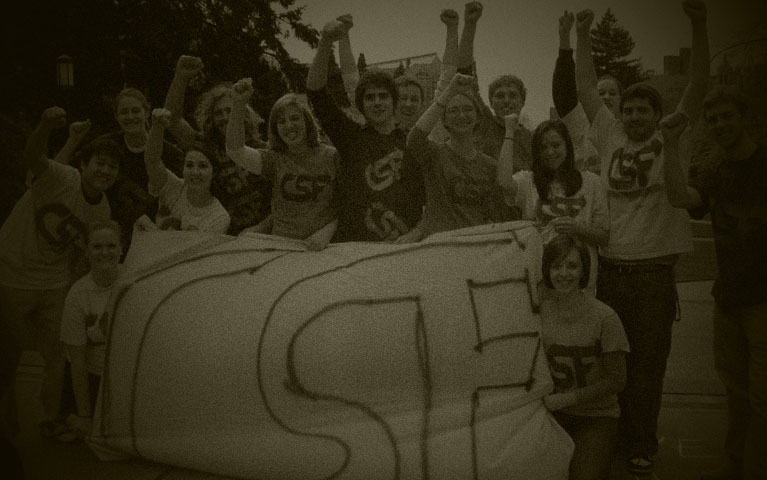 twenty five students in front of a csf logo sign