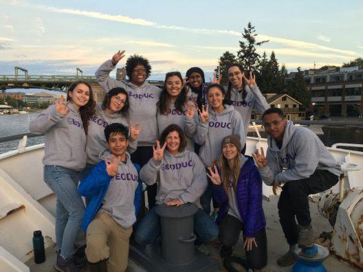 Group of atmospheric science students waving 