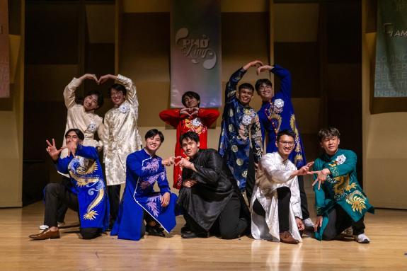 Phở King contestants posing together after performing modern/cultural opening dance.