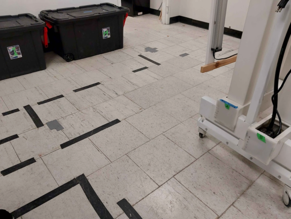 Damaged floors taped in place.
