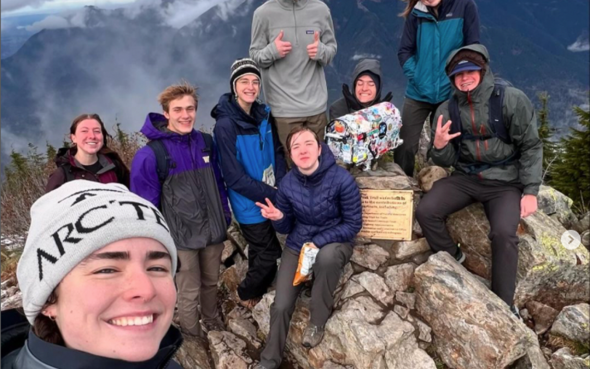 Group of people at the summit of a hike