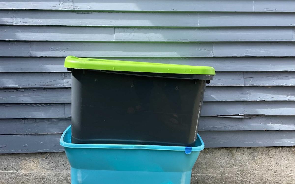 Two worm bins stacked on top of one another 