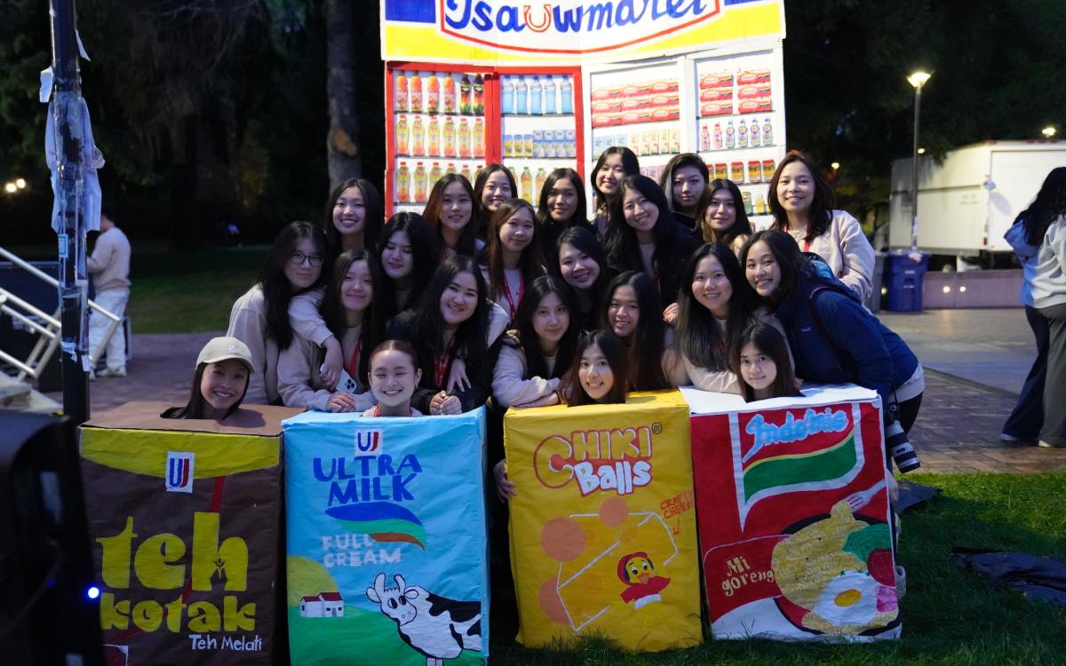 Group of students in front of colorful boxes 