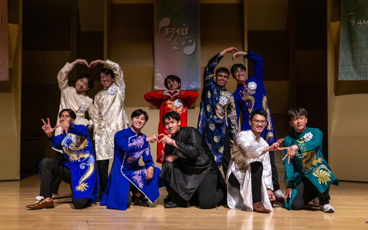 Phở King contestants posing together after performing modern/cultural opening dance.
