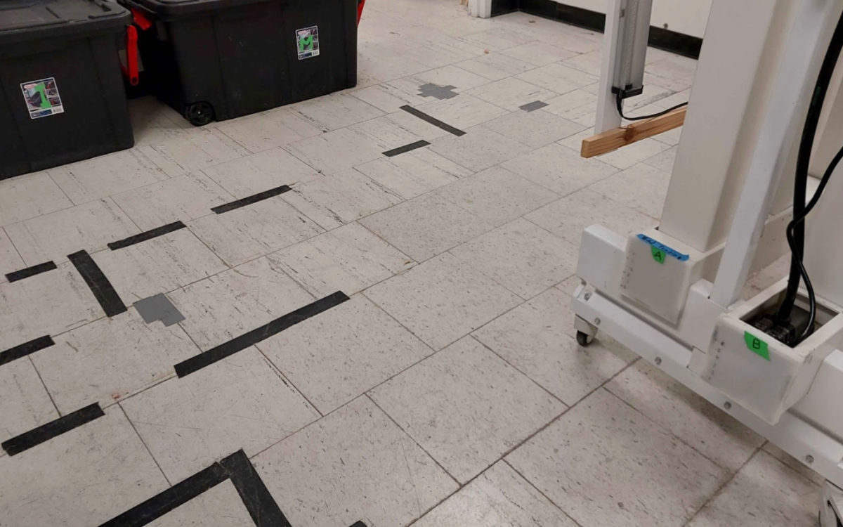 Damaged floors taped in place.